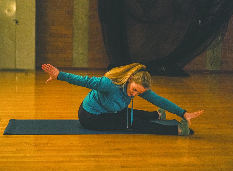 Stacie Attridge instructing pilates class.