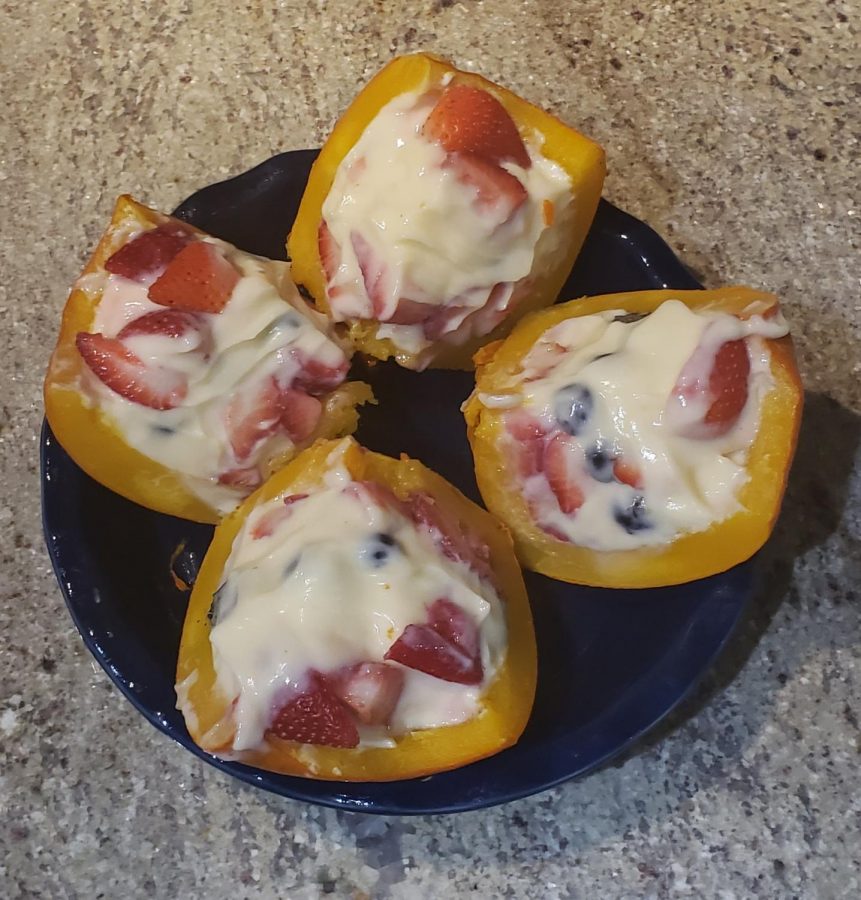 4 slices of mini pumpkin, stuffed with cheese cake, strawberries & blueberries