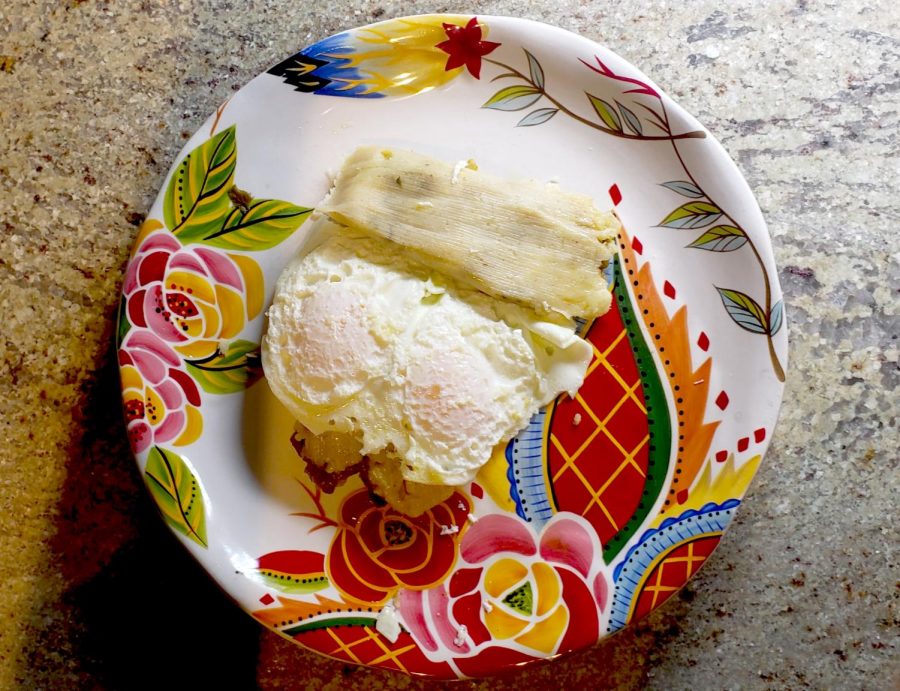 Sweet Green Corn Tamales topped with eggs and served for breakfast.