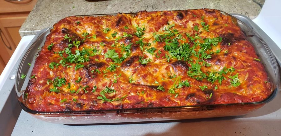 Lasagna topped with parsley.