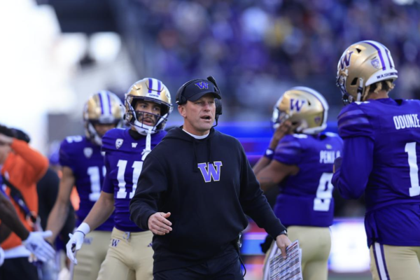 Kalen Deboer welcoming his offense after a touchdown scoring drive. The former University of Washington head coach left to coach the University of Alabama football team in early January. Photo Credit: University of Washington