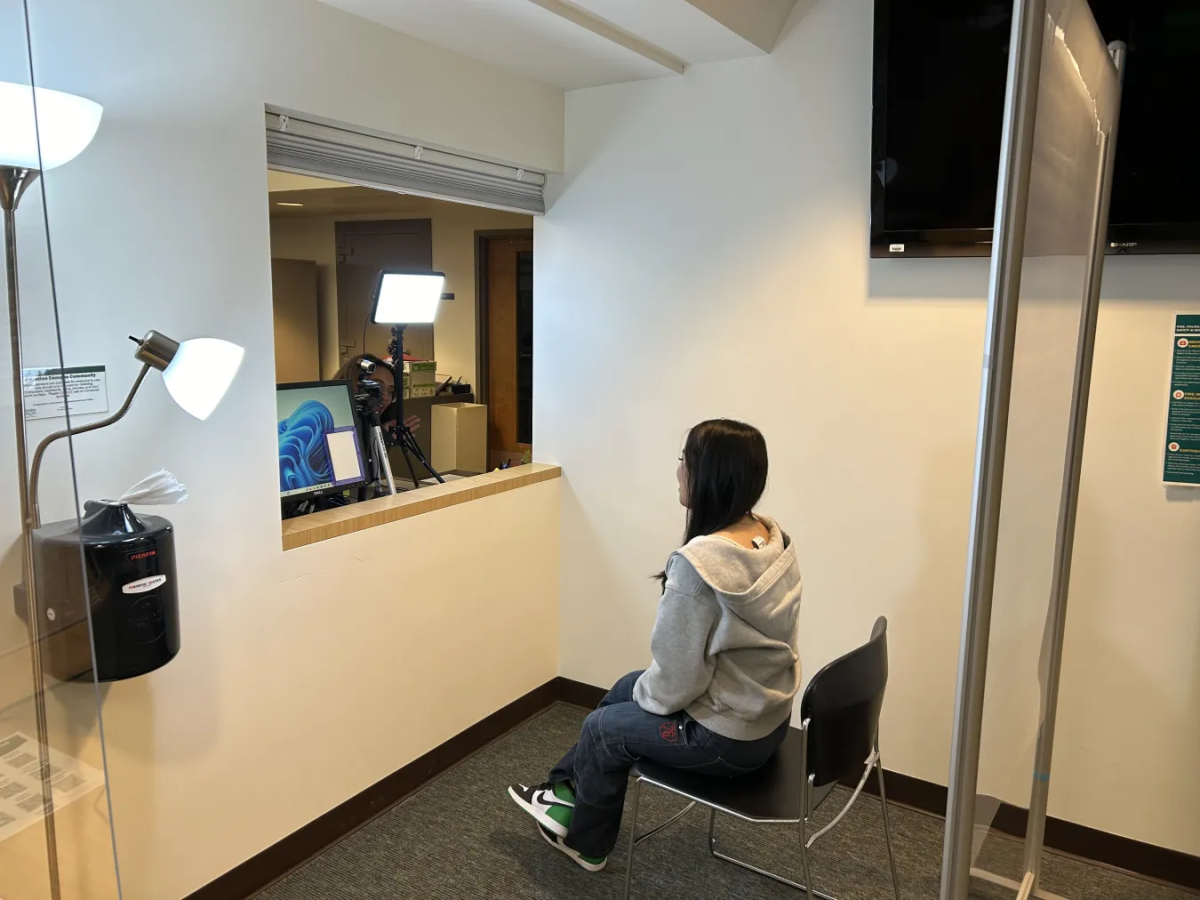 a student getting their photo taken for their new student ID