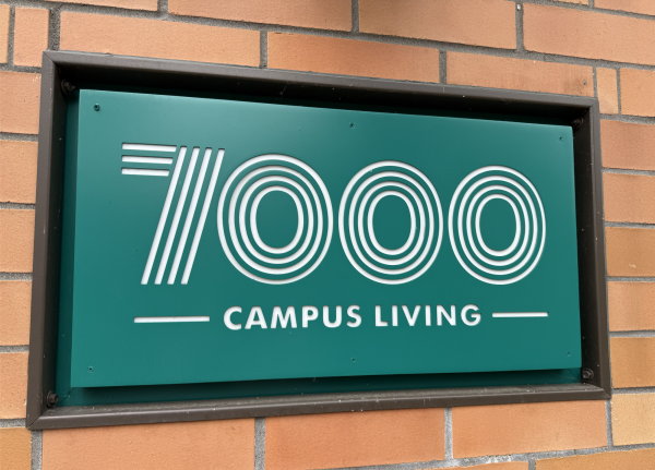 A sign posted on the 7000 Campus Living building.