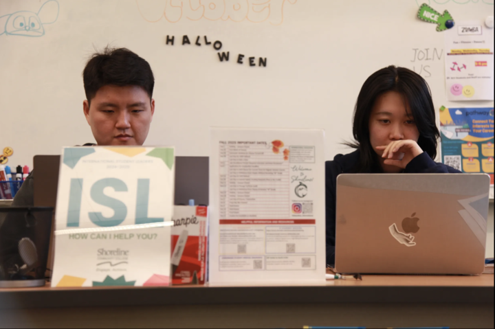 Students at the front desk of the International Student Leaders (ISL) are ready to assist fellow students with questions and resources.