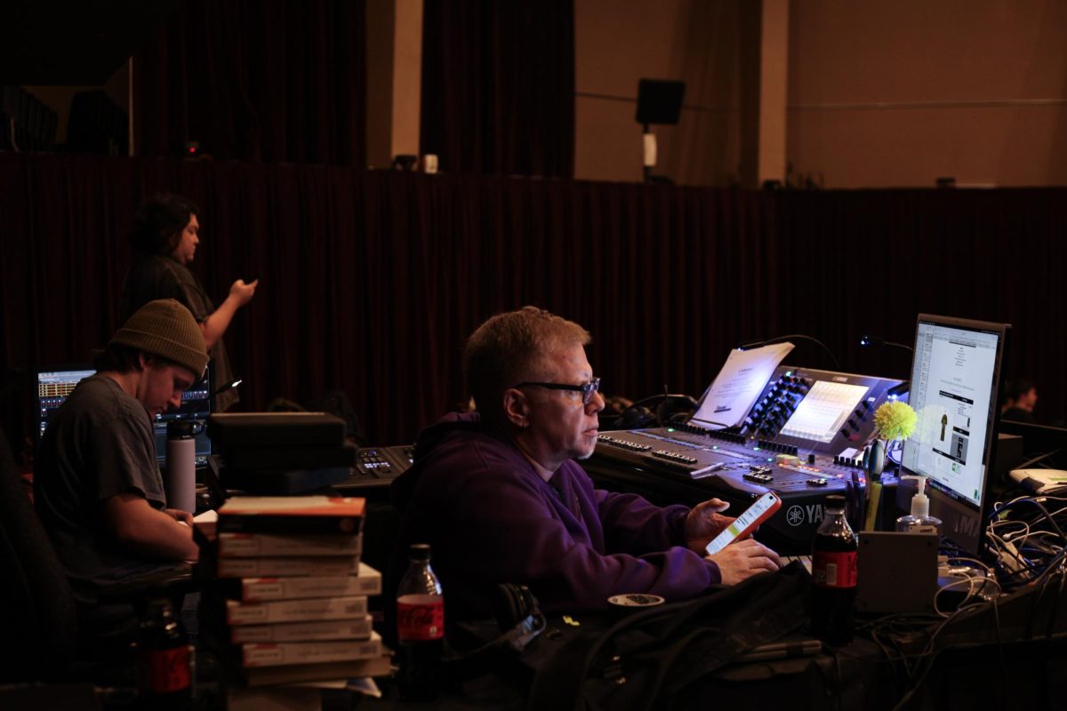 The production team for "Cabaret" watch the rehersal intently.