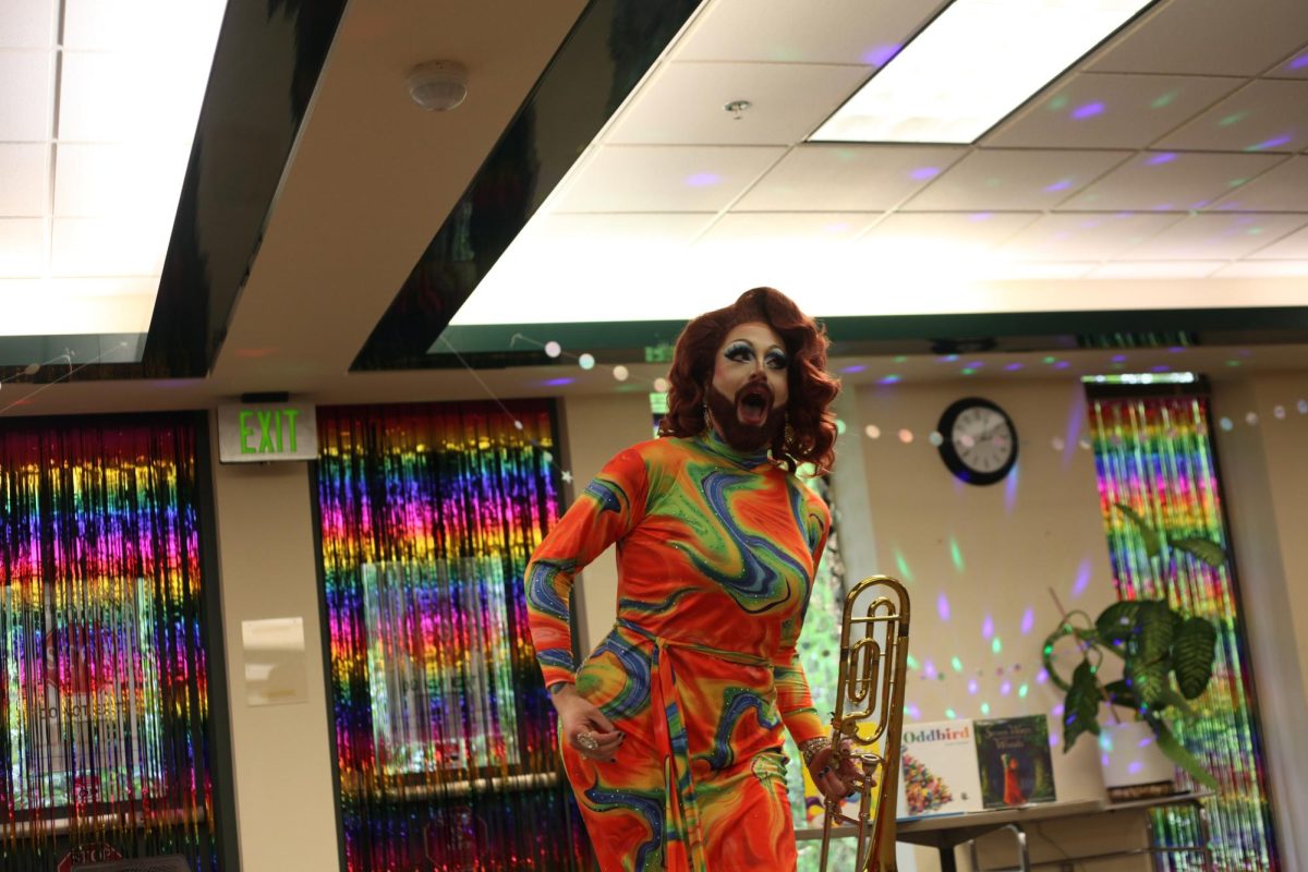 Brassy Aire performing "My Heart Will Go On" by Celine Dion with trumpet in hand.